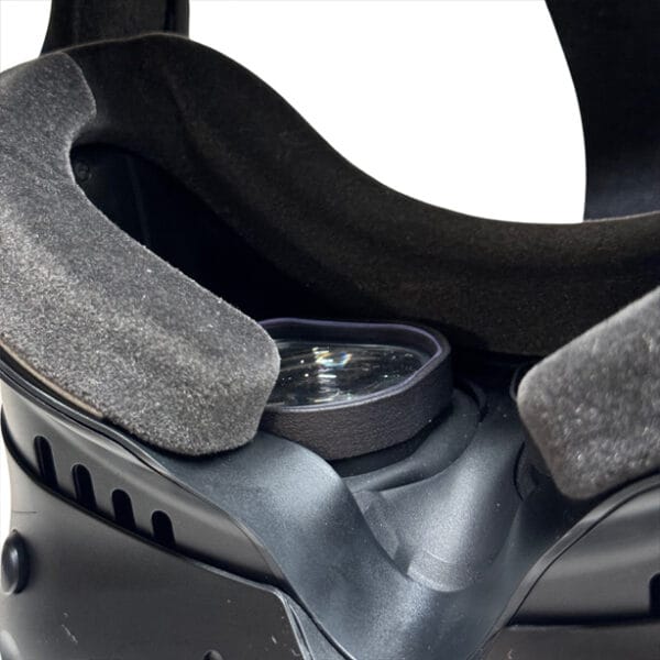 Close-up of HTC Focus 3 headset with prescription lenses securely mounted inside foam interface