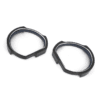 Close-up of detachable HTC Vive prescription lens adapters shown separately from headset