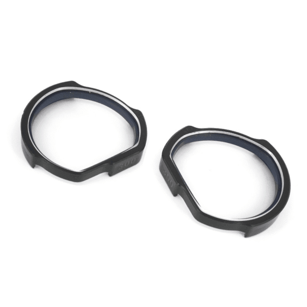 Close-up of detachable HTC Vive prescription lens adapters shown separately from headset
