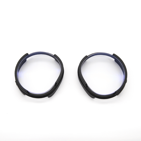 Pair of anti-glare prescription lenses for Pimax Crystal laid out for inspection