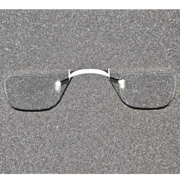 Flat-lay display of XREAL One prescription lenses and nose bridge bracket