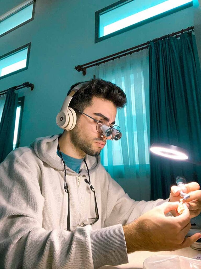 Person adjusting VR headset in well-lit room