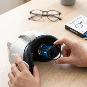 ands installing ANNKUTVR prescription lenses onto a white Meta Quest 3 headset, with a pair of discarded frame glasses in the background symbolizing the upgrade.