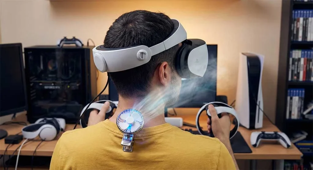 Gamer using a fan while playing PSVR2 to prevent fogging.