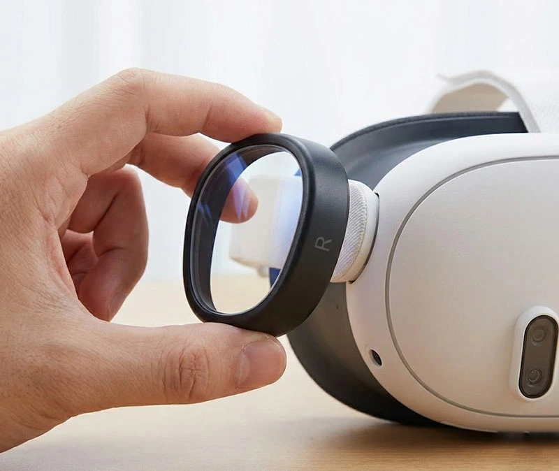 Installing the magnetic prescription lens insert onto the Meta Quest 3 headset.