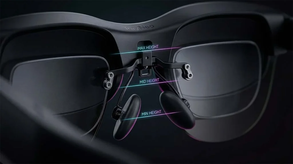 Extreme close-up of the adjustable metal and silicone nose pad mechanism with three glowing lines indicating height levels.